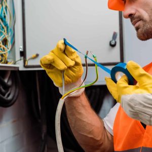 cropped-view-of-electrician-using-insulating-tape-while-fixing-wires-of-electric-panel.jpg